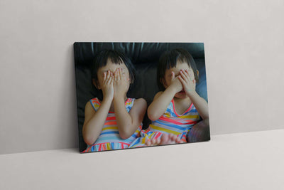 Sisters Covering Faces (Canvas Prints)
